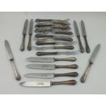 C**H** BEATSOM A SET OF TEN SILVER HANDLED TEA KNIVES AND FORKS, each having later stainless steel