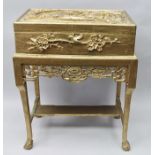 A 19TH CENTURY CHINESE BOX ON STAND, gilded elaborately carved landscape and blossom decoration,