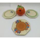 A CLARICE CLIFF MARMALADE JAR, together with three octagonal "Crocus" patterned TEA PLATES, 14cm