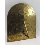 AN EARLY BRASS SUNDIAL, wall mounting arched plate, engraved with text and calibrations, bears the