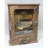 AN EARLY 20TH CENTURY WOODEN CASED PENNY ARCADE GAME with clown character, Ref.No.23431, circa 1900,