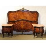 A PAIR OF FRENCH MARQUETRY INLAID BOMBE FORM BEDSIDE CHESTS OF TWO DRAWERS, with serpentine rouge