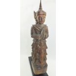 A 19TH CENTURY LAOS CARVED WOOD BUDDHIST GODDESS TEMPLE FINIAL, hands clasped in devotion, ornate