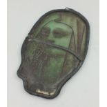 A STAINED/PAINTED GLASS PANEL, of a woman's hooded head, from a larger early panel, leaded framed,