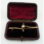 A DIAMOND SET BAR BROOCH, scrolling yellow metal design, in leather cased box