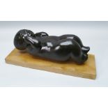 CONSTANCE ANN PARKER (1921-2016) A MID 20TH CENTURY CARVED WOOD SCULPTURE IN THE FORM OF A BABY,