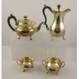 NATHAN & HAYES AN EDWARDIAN FOUR PIECE SILVER TEASET comprising; teapot, hot water, sugar and