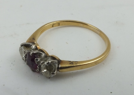 A RUBY AND DIAMOND LADY'S RING, on yellow metal band, size P