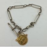 A GOLD SOVEREIGN 1889, SOLDERED TO A PENDANT mount, suspended from a long link SILVER WATCH CHAIN