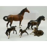 A COLLECTION OF FIVE BESWICK PORCELAIN ANIMALS to include; a matt coloured mare with swishing