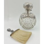 AN EDWARDIAN SILVER MOUNTED GRENADE FORM SCENT BOTTLE, the embossed and hinged cover, opens to