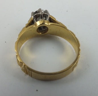 A SOLITAIRE DIAMOND RING, highly set, mounted upon a bark effect 18ct gold band, size M 1/2 - Image 2 of 2