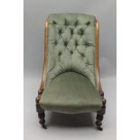 A 19TH CENTURY MAHOGANY FRAMED NURSING STYLE CHAIR sea-green velour upholstered, having button