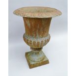 A CAST METAL URN VASE of campagna form on square platform foot, 40cm high