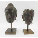 TWO 18TH CENTURY BRONZE THAI BUDDHA HEADS, one Sukhothai - upon display stand, 15.5cm, the other -