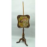 A MID VICTORIAN MAHOGANY POLE SCREEN, rose pattern wool work panel set in decorative frame on pole