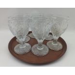 A SET OF SIX BACCARAT MOULDED WINE GLASSES, the bowls with panels of acanthus leaf, on twisted stems