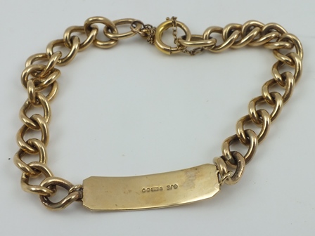 A 9CT GOLD IDENTITY BRACELET, plain bar, with chain links, 31g.