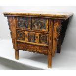 A CHINESE ELM CHEST OF DRAWERS, on plank supports, top 108cm x 70cm