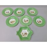 A ROYAL CROWN DERBY PART DESSERT SET, comprising six plates and a hexagonal serving dish, each