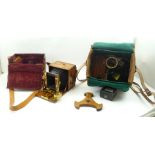 "ADAMS & CO., LONDON" A MAHOGANY BRASS MOUNTED PLATE CAMERA in leather carry case, with various
