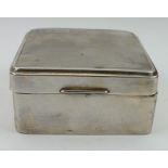 A SILVER CIGARETTE BOX, engine turned hinged cover, London 1926, 8.5cm wide