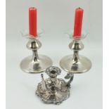 CHARLES EDWIN TURNER A PAIR OF SILVER CANDLE HOLDERS having knop form stems, on circular platform