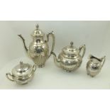 A GERMAN FOUR PIECE SILVER TEA AND COFFEE SERVICE, of fluted form with repousse swags and ribbons,