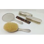 A FOUR PIECE SILVER MOUNTED ENGINE TURNED DRESSING TABLE SET, comprising hand mirror, comb, two
