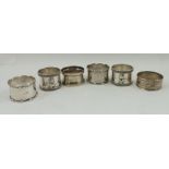 A PAIR OF SILVER PLATED R.A.F. MESS NAPKIN RINGS, having applied crest, together with four silver