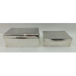 TWO SILVER CIGARETTE BOXES, having hinged lids, cedar lined, hallmarks worn, largest 14cm wide (2)