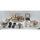 A COLLECTION OF PREDOMINANTLY SILVER-PLATED WARES to include; chased coffee pot, oval galleried