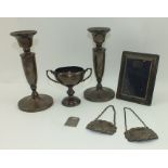 BARKER BROTHERS LTD A PAIR OF LATE 20TH CENTURY SILVER CANDLESTICKS on circular platform bases, 16.