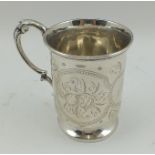 H.J. LIAS & SON A MID VICTORIAN SILVER CHRISTENING MUG, having chased floral decoration,