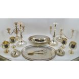 A COLLECTION OF SILVER-PLATED WARES to include; candelabrum, goblets, entree dish and cover, 2 pairs