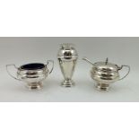 WALKER & HALL A THREE-PIECE SILVER CONDIMENT SET comprising; pepper pot, salt and lidded mustard