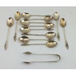 LEE & WIGFULL A SET OF TWELVE VICTORIAN SILVER COFFEE SPOONS with apostle terminals, cased and a