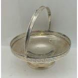 DOCKER & BURN LTD. A SILVER FRUIT BASKET, having swing handle and pierced rim, raised on circular