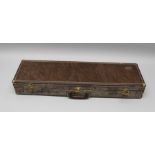 A BROWNING LEATHER GUN CASE with brassed mounts and plush fitted interior, bears maker's label,