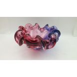 A MURANO VETRERIA ARTISTICA OBALL AMORPHIC GLASS BOWL, in pink and lavender colours, bears labels,