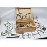 A COLLECTION OF 26 HORSE BITS, including driving, snaffles etc. all in wooden box with brass