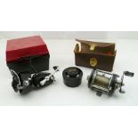 AN "ABU AMBASSADEUR 6000 C" SEA FISHING REEL, cased, together with a "MITCHELL 300 SPINNING REEL (