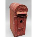 A CAST IRON GEORGE V POST BOX with Hovis top, 52cm high