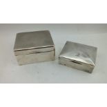 AN ENGINE TURNED SILVER CIGARETTE BOX, cedar lined, Birmingham 1925, 10cm wide, together with a