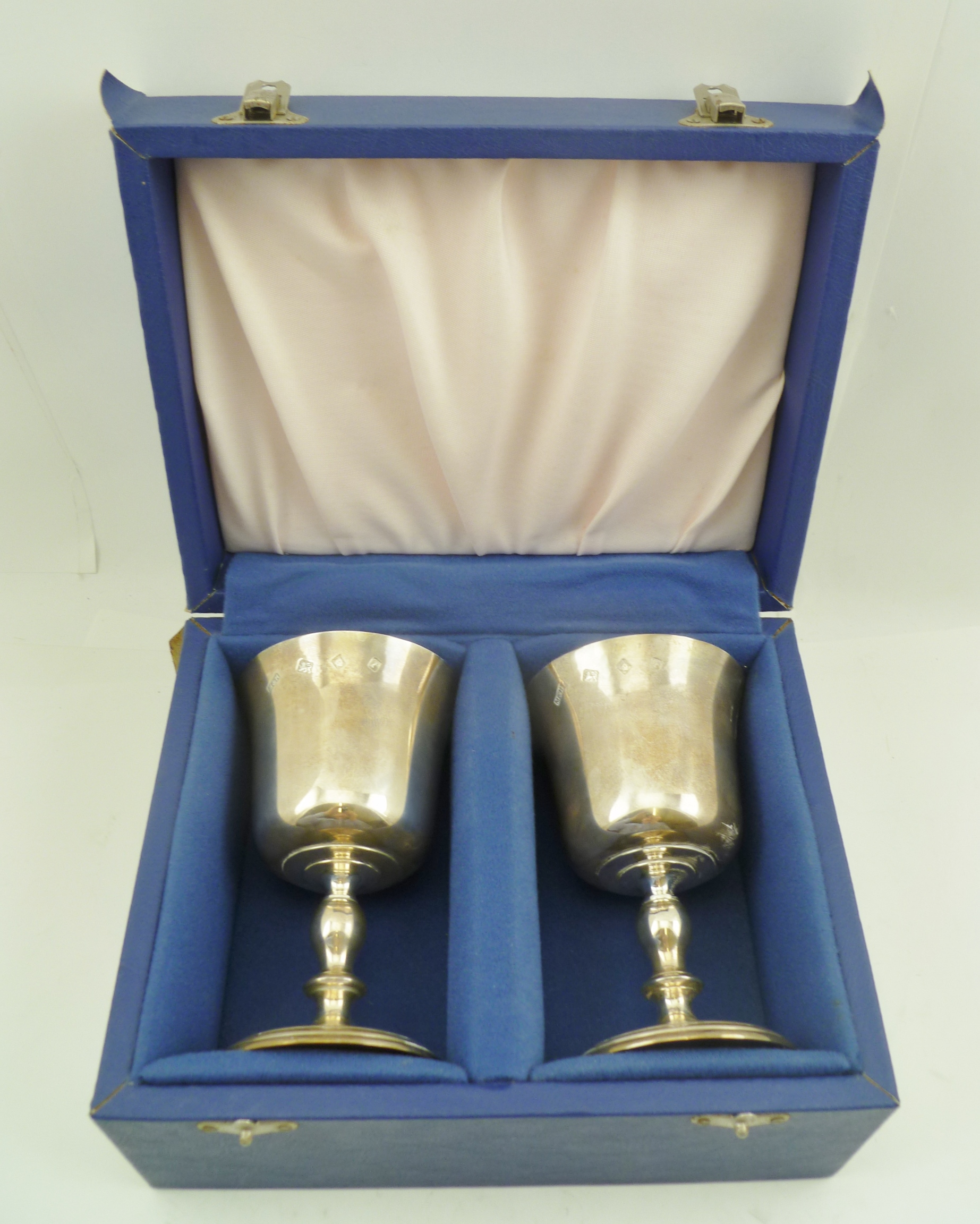 MILLS & HERSEY A PAIR OF SILVER STEMMED WINE GOBLETS, the interiors gilded with flared rim bowls, on