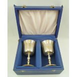 MILLS & HERSEY A PAIR OF SILVER STEMMED WINE GOBLETS, the interiors gilded with flared rim bowls, on