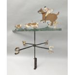 A WROUGHT METAL WEATHER VANE in the form of the hunt with huntsman and hounds, width 77cm