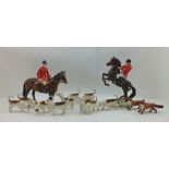 A BESWICK POTTERY HUNT, comprising two huntsmen on brown horses, one rearing, model no. 868,