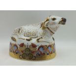 A ROYAL CROWN DERBY PAPERWEIGHT of a Water Buffalo, seated, with gold stopper, boxed, 17cm wide