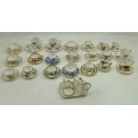 A COLLECTION OF MINIATURE CERAMIC CUPS AND SAUCERS, factories such as Shelley, Spode, Coalport,